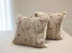 Linen cushion with raised roses